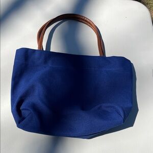 Elegant Blue Tote Bag with Brown Handles